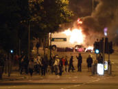A van alight in Toxteth, inner Liverpool as violence broke out Monday night.