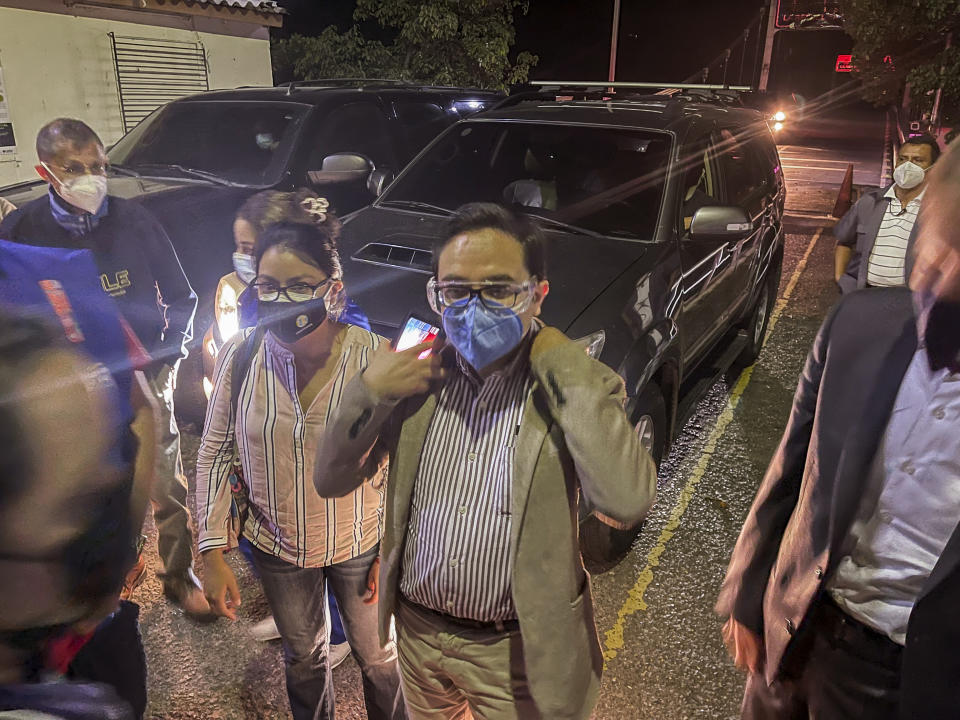 The special Prosecutor's Office Against Impunity, Juan Francisco Sandoval, center, enters to Las Chinamas, El Salvador, on the border with Guatemala, early Saturday, July 24, 2021. Guatemala's attorney general has removed Sandoval less than two months after U.S. Vice President Kamala Harris stressed the office's importance amid a growing push against anti-corruption efforts in the country. (AP Photo/Sonia Perez Diaz)