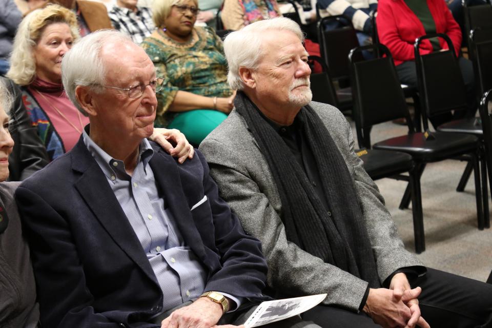 John F. Andrews (left) and Dwight T. Pitcaithley listen to a speech during an induction ceremony at the Carlsbad Hall of Fame.