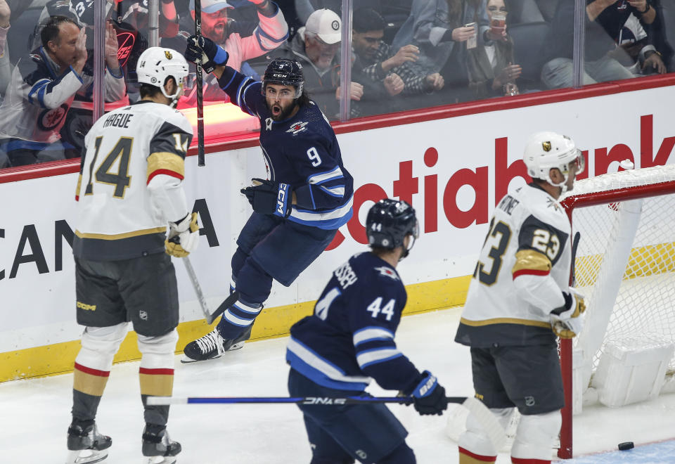 Winnipeg Jets' Alex Iafallo (9) celebrates after his goal against the Vegas Golden Knights during first-period NHL hockey game action in Winnipeg, Manitoba, Thursday, Oct. 19, 2023. (John Woods/The Canadian Press via AP)