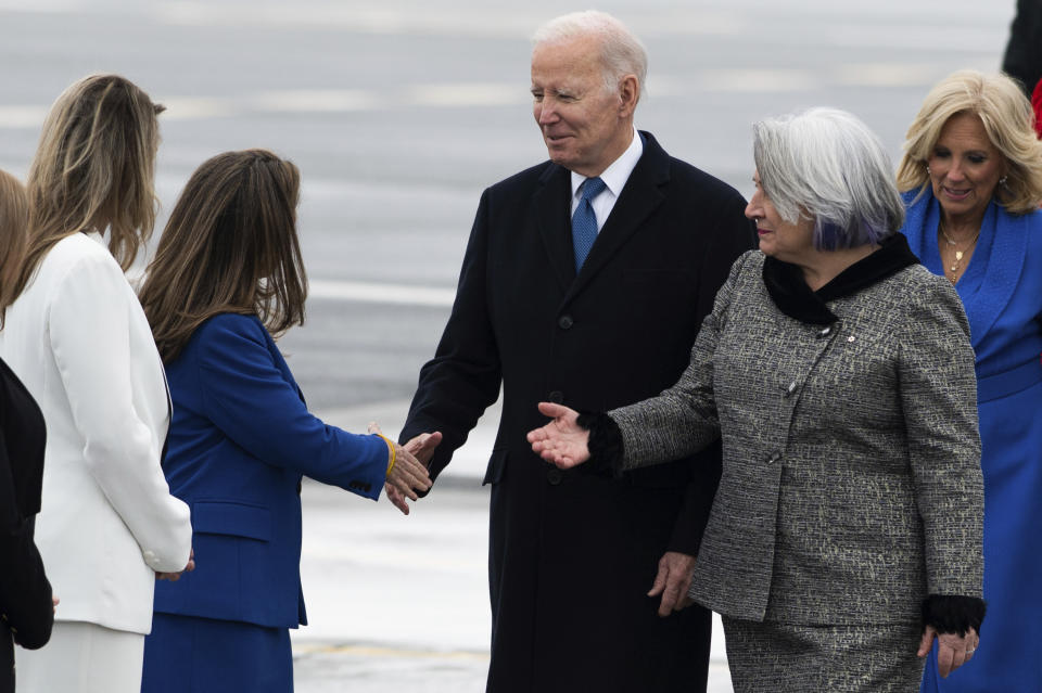 President Joe Biden greets Deputy Prime Minister and Minister of Finance Chrystia Freeland, second from left, at Ottawa/Macdonald–Cartier International Airport ahead of an official state visit in Ottawa, Ontario, Thursday, March 23, 2023. (Spencer Colby/The Canadian Press via AP)