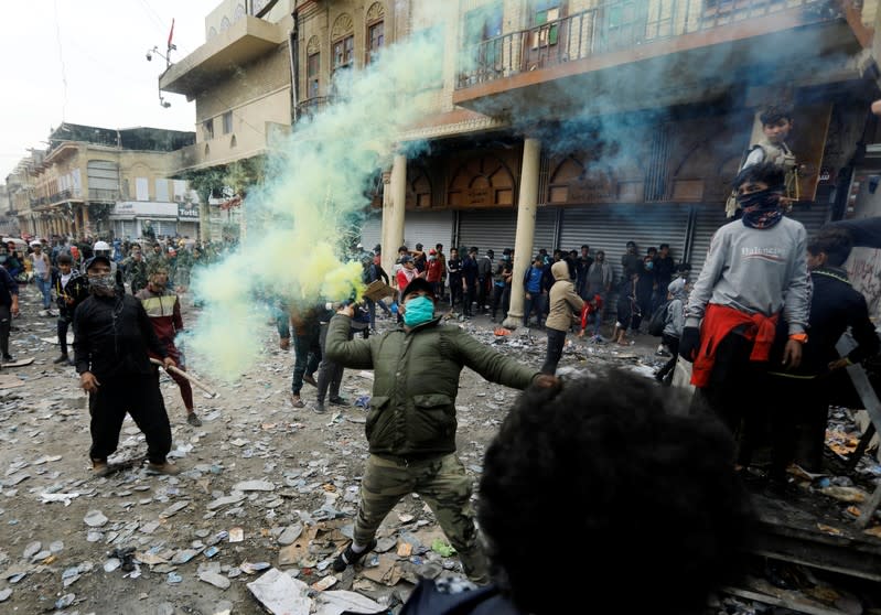 Iraqi demonstrators take part during the ongoing anti-government protests, in Baghdad