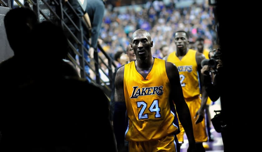 Kobe Bryant walks off the court to the locker room at halftime of a 118-115 loss to the Kings at Sleep Train Arena.