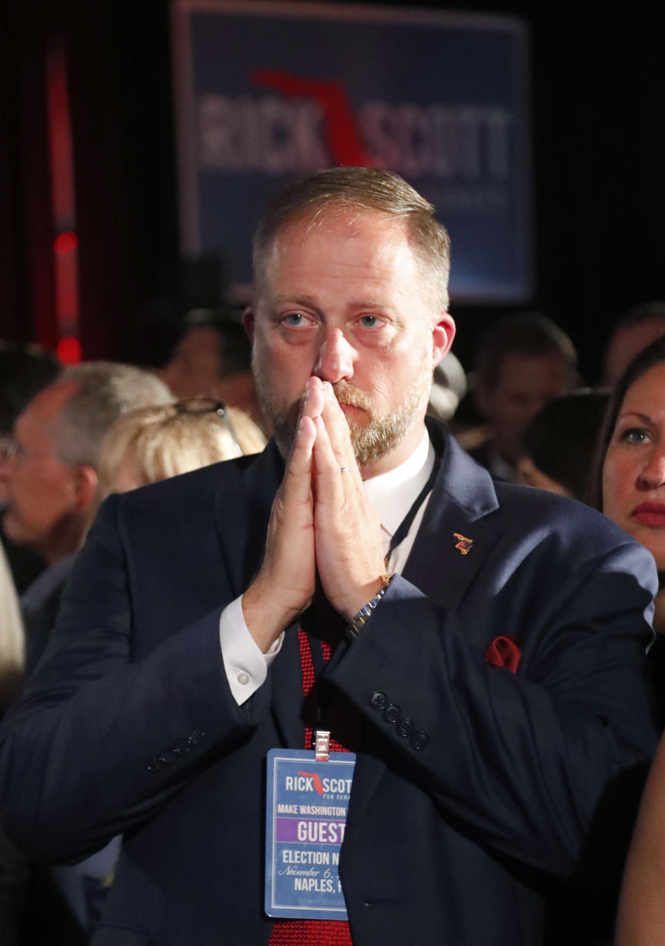 Danny Nix watches televised election results at an election watch party, Tuesday, Nov. 6, 2018, in Naples, Fla. (AP Photo/Wilfredo Lee)