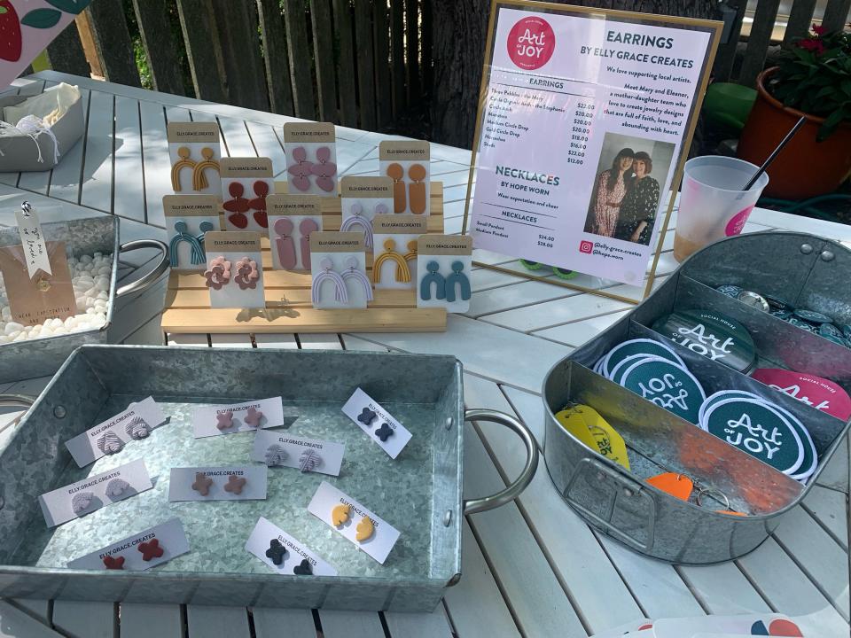 A table displays handmade earrings outside the Art of Joy in Cedarburg on July 17, 2022. The Art of Joy opened outdoors in June.