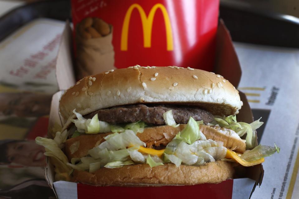 In this Tuesday, Jan. 21, 2014, photo, a McDonald's Big Mac sandwich is photogr at a McDonald's restaurant in Robinson Township, Pa., Tuesday, Jan. 21, 2014. Several lawsuits being filed against McDonald'ssay the fast-food chain engages in a variety of practices to avoid paying workers what they're owed.(AP Photo/Gene J. Puskar)