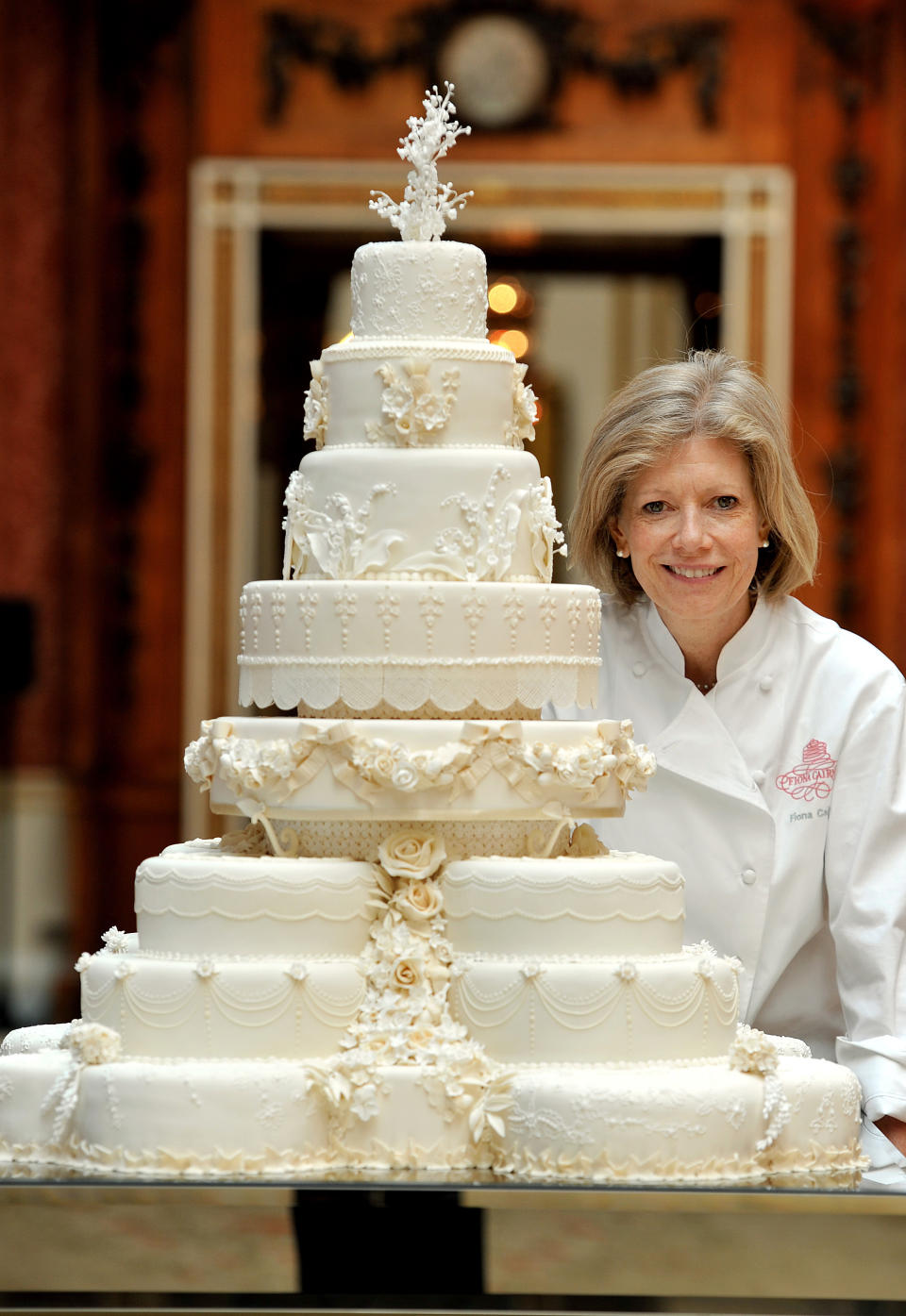 <p>Prince William and Kate Middleton, as she was known then, opted for a very traditional eight-tier fruit cake for their wedding in 2011. Designed by royal baker Fiona Cairns, the cake boasted hundreds of iced flowers and lace details from the Duchess’s dress.<em> [Photo: Getty]</em> </p>