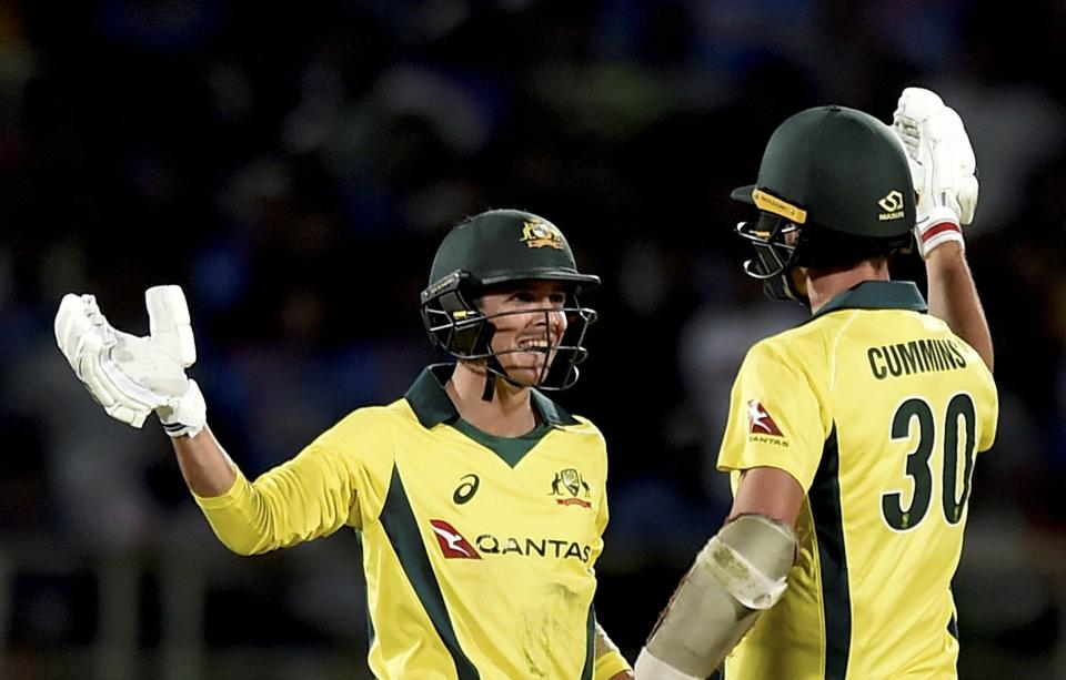 Vizag: Australia's Pat Cummins and Jhye Richardson celebrate after winning the first T20 international cricket match against India at the Dr YS Rajasekhara Reddy ACA–VDCA Cricket Stadium in Vizag, on Sunday, Feb. 24, 2019. (PTI Photo/R Senthil Kumar)(PTI2_24_2019_000243B)