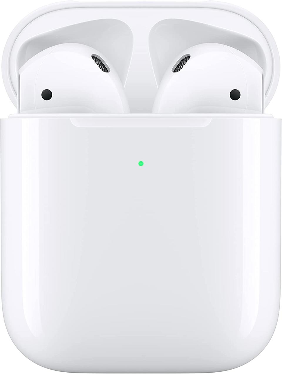 Apple AirPods (2nd Gen) wireless earphones inside wireless charging case on white background