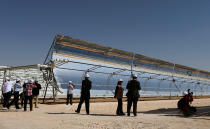 Journalists visit the Shams 1, Concentrated Solar power (CSP) plant, in al-Gharibiyah district on the outskirts of Abu Dhabi. (MARWAN NAAMANI/AFP/Getty Images)