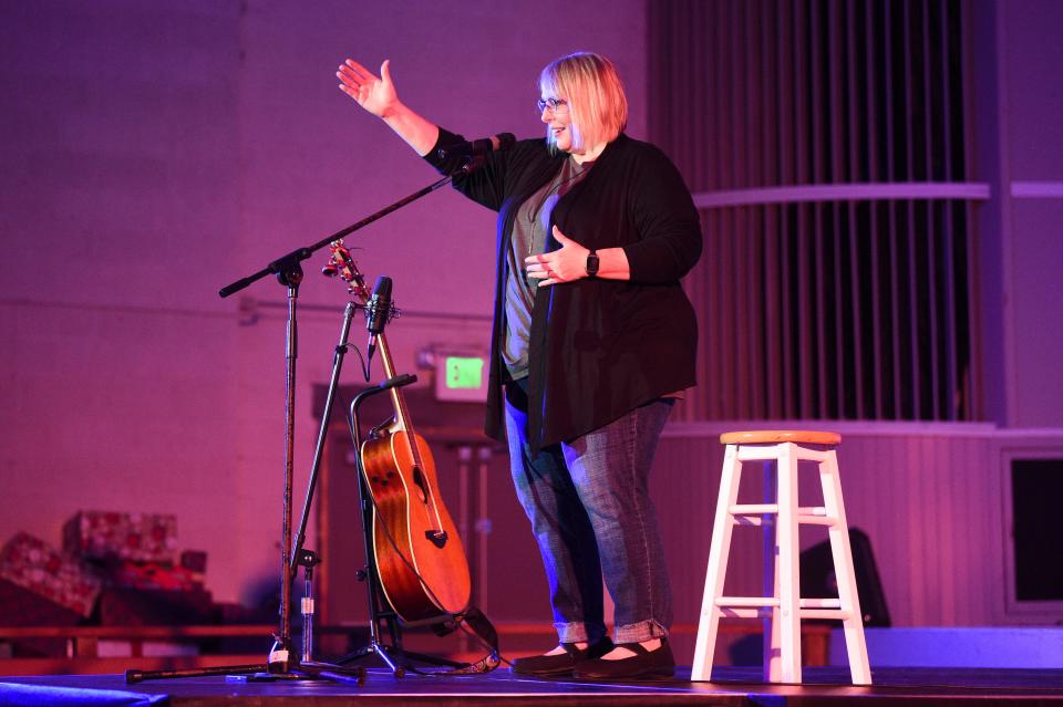 Kim Weitkamp takes the stage at Flatwater Tales held in the Historic Grove Theater in Oak Ridge, Friday, June 3, 2022.