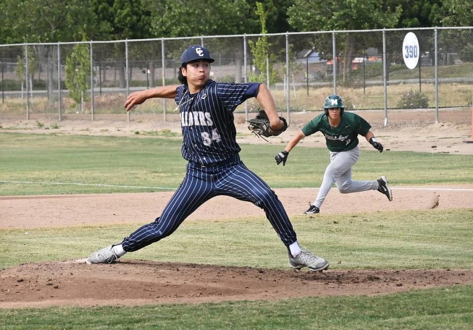 Central Catholic’s Adrian Garcia delivers a pitch as Manteca’s Jayson Ingraca leads off first base during the Valley Oak League game in Modesto, Calif., Friday, May 5, 2023. Central Catholic won the game 6-2.