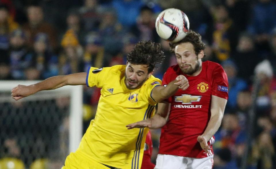 <p>Aleksandr Erokhin challenges Manchester United’s Daley Blind</p>