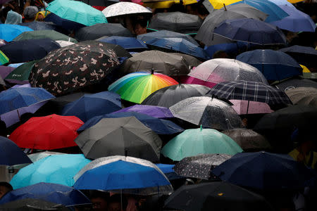 A rainbow umbrella is seen during a rally to support Same-sex marriage during parliament vote on three different draft bills of a same-sex marriage law, outside the Legislative Yuan in Taipei, Taiwan May 17, 2019. REUTERS/Tyrone Siu