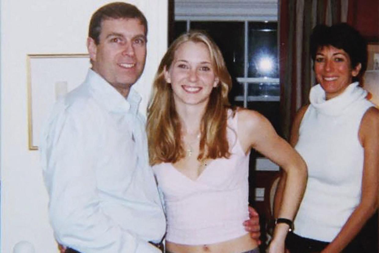 (FILES) In this file undated handout photo taken at an undisclosed location and released on August 9, 2021 by the United States District Couty for the Southern District of New York shows (L-R) Prince Andrew, Virginia Giuffre, and Ghislaine Maxwell posing for a photo. - Disgraced former socialite Ghislaine Maxwell has claimed in a jailhouse interview with a UK broadcaster that a decades-old photograph of Prince Andrew with his arm around his sexual abuse accuser Virginia Giuffre's waist and Maxwell standing next to them -- said to have been taken in London in 2001 -- is "fake". Maxwell, is imprisoned in a Florida penitentiary after her conviction and 20-year sentence for helping late financier Jeffrey Epstein sexually abuse girls. (Photo by Handout / US District Court - Southern District of New York (SDNY) / AFP) / RESTRICTED TO EDITORIAL USE - MANDATORY CREDIT "AFP PHOTO / UNITED STATES DISTRICT COURT FOR THE SOUTHERN DISTRICT OF NEW YORK" - NO MARKETING - NO ADVERTISING CAMPAIGNS - DISTRIBUTED AS A SERVICE TO CLIENTS (Photo by HANDOUT/US District Court - Southern Dis/AFP via Getty Images)