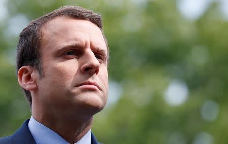 Emmanuel Macron, head of the political movement En Marche !, or Onwards !, and candidate for the 2017 French presidential election, attends a ceremony at a monument in memory of mass killings of Armenians by Ottoman forces in 1915, in Paris, France, April 24, 2017. REUTERS/Christian Hartmann