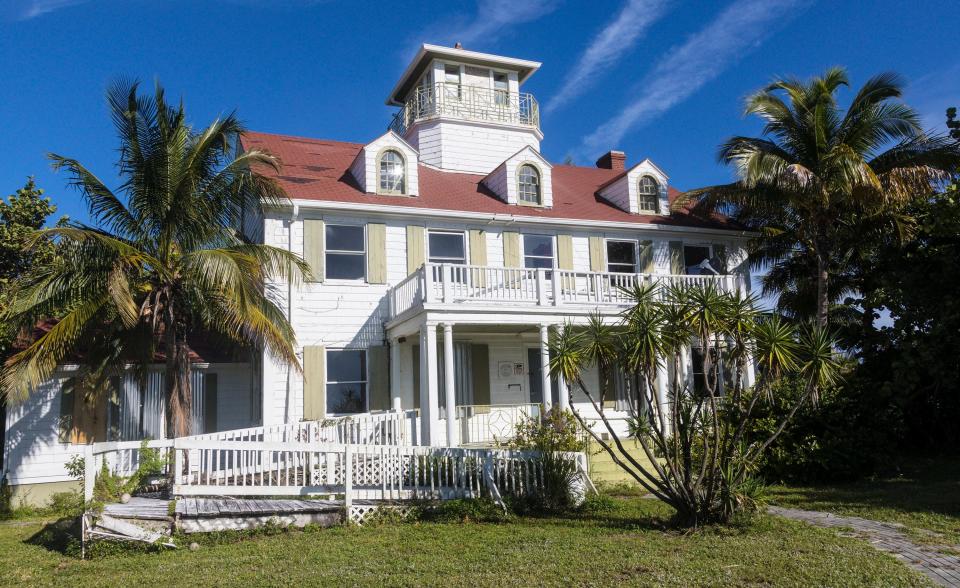 The Coast Guard station on Peanut Island Monday November 25, 2019.  The Coast Guard station, a two-story frame Colonial Revival-style building built in 1936, served as a base for coastal patrols and rescue missions during World War II. The building, along with the Cold War-era John F. Kennedy bunker and boathouse, are closed to the public while efforts are ongoing to refurbish them.  The bunker was built in 1961 as a top-secret nuclear bomb shelter for President Kennedy in case of an attack while he was visiting his “winter White House” on the north end of Palm Beach.