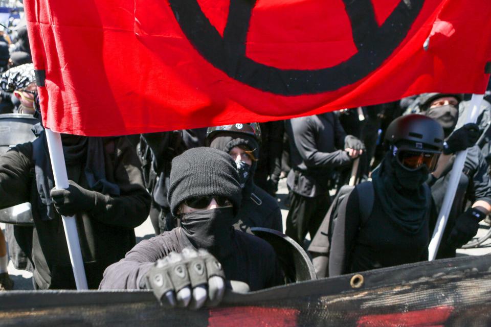 Antifa members and counter protesters gather during a right-wing No-To-Marxism rally on August 27, 2017 in Berkeley, California.  / Credit: Amy Osborne / AFP/Getty Images