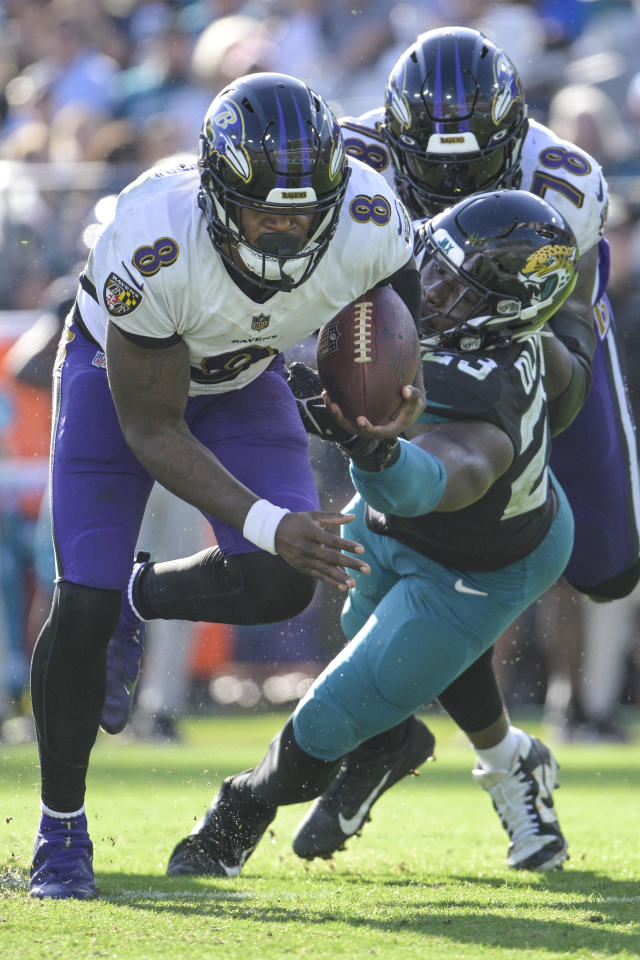 Lamar Jackson of the Baltimore Ravens scrambles against the