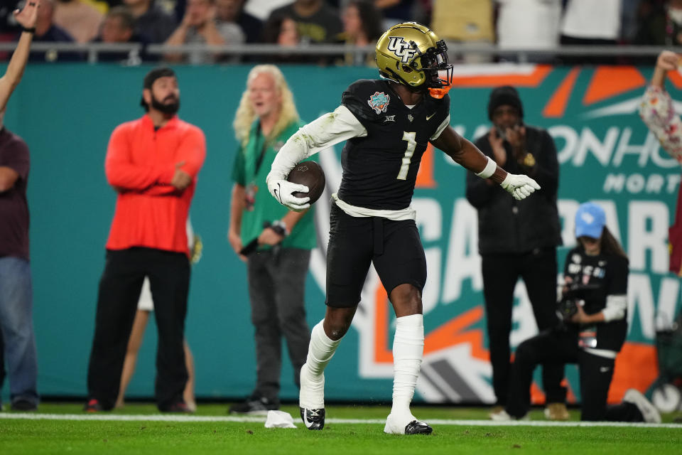 Dec 22, 2023; Tampa, FL, USA; UCF Knights wide receiver Javon Baker (1) celebrates his touchdown against the Georgia Tech Yellow Jackets during the first half of the Gasparilla Bowl at Raymond James Stadium. Mandatory Credit: Jasen Vinlove-USA TODAY Sports