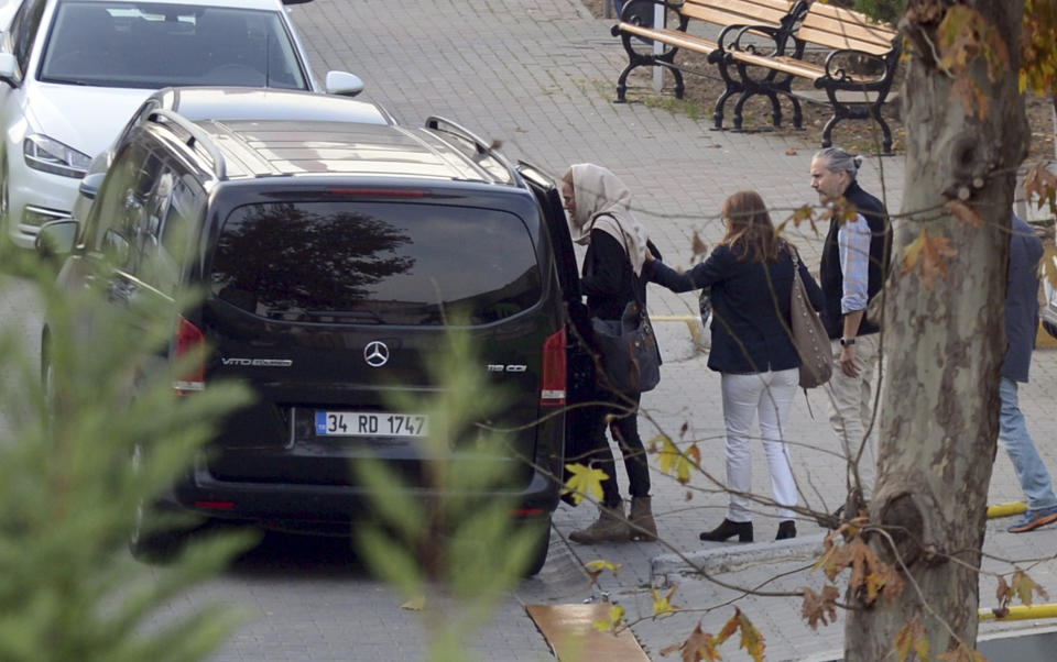 Emma Hedvig Christina Winber, the wife of British army officer James Le Mesurier who helped found the "White Helmets" volunteer organization in Syria, left, enters a car as she leaves the Forensic Medicine Institute, in Istanbul, Wednesday, Nov. 13, 2019. The Istanbul chief prosecutor's office said Tuesday an autopsy and other procedures were underway at Istanbul's Forensic Medicine Institute to determine "the exact cause" of Le Mesurier's death.(Ismail Coskun/IHA via AP)