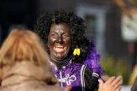 "Zwarte Piet" (Black Pete), who is a Saint Nicholas' assistant is seen during a traditional parade in Zaanstad, Netherlands, November 17, 2018. Picture taken November 17, 2018. REUTERS/Eva Plevier