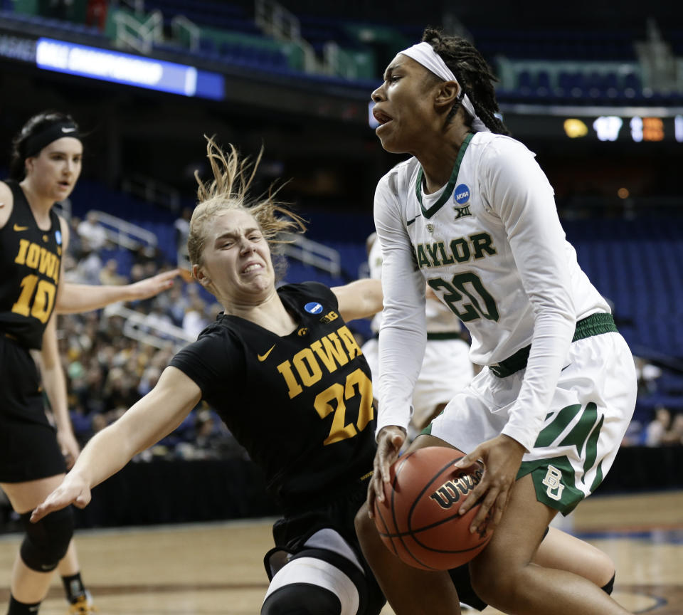 Baylor's Juicy Landrum (20) runs into Iowa's Kathleen Doyle (22) during the first half of a regional final women's college basketball game in the NCAA Tournament in Greensboro, N.C., Monday, April 1, 2019. (AP Photo/Gerry Broome)