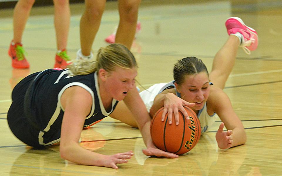 Sioux Valley's Liberty Trygstad (left) and Hamlin's Marissa Bawdon hit the floor to battle for a loose ball during their high school girls basketball game on Monday, Feb. 5, 2024 at the Hamlin Education Center.