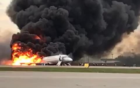 The plane went up in flames after the emergency landing at Sheremetyevo airport outside Moscow - Credit: AFP
