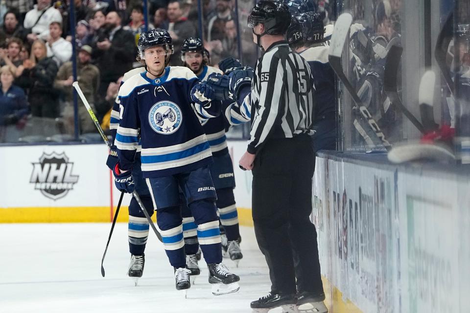 Blue Jackets defenseman Adam Boqvist celebrates scoring his first goal of the season Tuesday against the Devils.