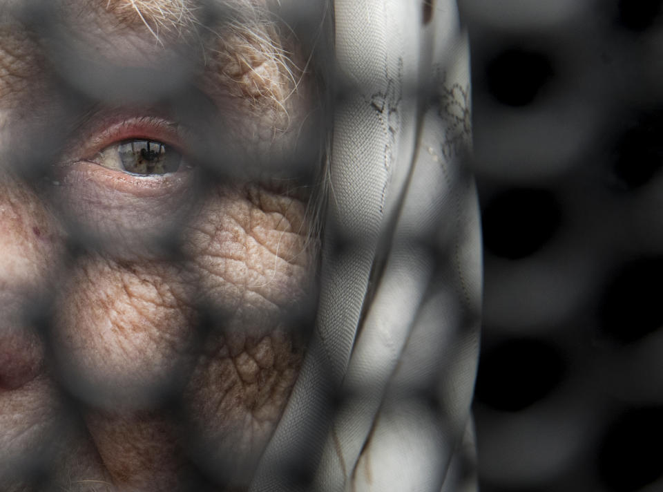 Ana, an 88-year-old Greek Catholic, waits for the arrival of Pope Francis and the start of the Divine Liturgy and the beatification of seven martyred bishops of the Eastern-rite Romanian Catholic Church, in Blaj, Romania, on June 2, 2019. (AP Photo/Vadim Ghirda)