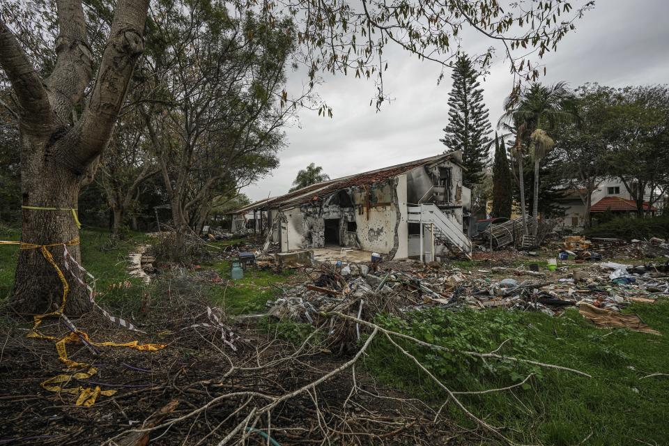 A battle-scarred home in Kibbutz Be'eri, an Israeli communal farm on the Gaza border, is seen Thursday, Jan. 11, 2024. Hamas held more than a dozen hostages in the home when it overran southern Israel on Oct. 7. At the end of an hours-long battle between the militants and Israeli forces, only two hostages survived, and relatives of the slain hostages now demand to know if their loved ones were killed by friendly fire from an Israeli tank (AP Photo/Tsafrir Abayov)