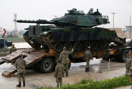 A Turkish military tanks arrives at an army base in the border town of Reyhanli near the Turkish-Syrian border in Hatay province, Turkey January 17, 2018. REUTERS/Osman Orsal