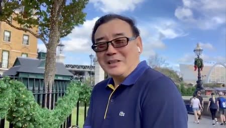 Still image from video of Australian writer Yang Hengjun wishes Happy New Year to his Twitter followers at an unidentified location