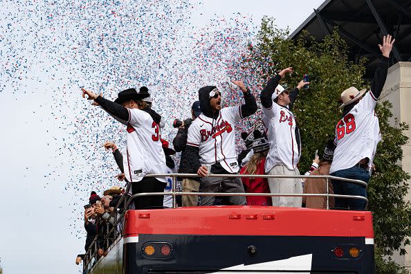 ATLANTA, GA - NOVEMBER 05: Atlanta Braves cheering from the top of their float during the World Series Parade at Truist Park on November 5, 2021 in Atlanta, Georgia. The Atlanta Braves won the World Series in six games against the Houston Astros winning their first championship since 1995. (Photo by Megan Varner/Getty Images)