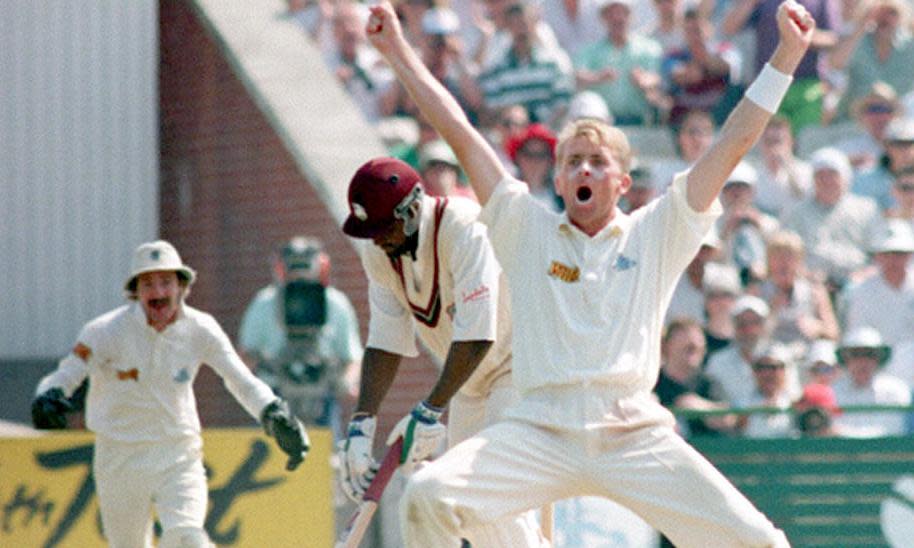 <span>Dominic Cork turns to claim the wicket of West Indies’ Carl Hooper, the third victim of his hat-trick during the fourth Test of the series at Old Trafford in July 1995.</span><span>Photograph: PA</span>