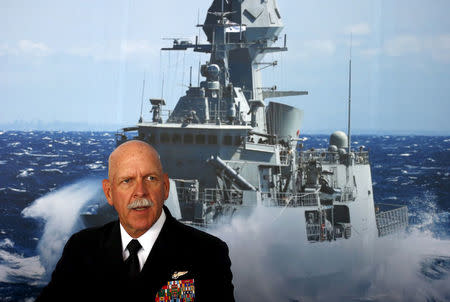 FILE PHOTO: Commander of the U.S. Pacific Fleet Admiral Scott Swift sits in front of a large poster of an Australian Navy frigate as he speaks during a media conference at the 2015 Pacific International Maratime Exposition in Sydney, Australia, October 6, 2015. REUTERS/David Gray/File Photo