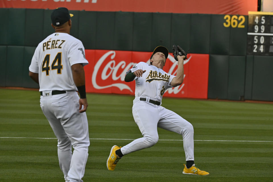 Oakland Athletics second baseman Zack Gelof catches the ball for the third out in the second inning of a baseball game against the Kansas City Royals in Oakland, Calif., Tuesday, Aug. 22, 2023. (AP Photo/Nic Coury)