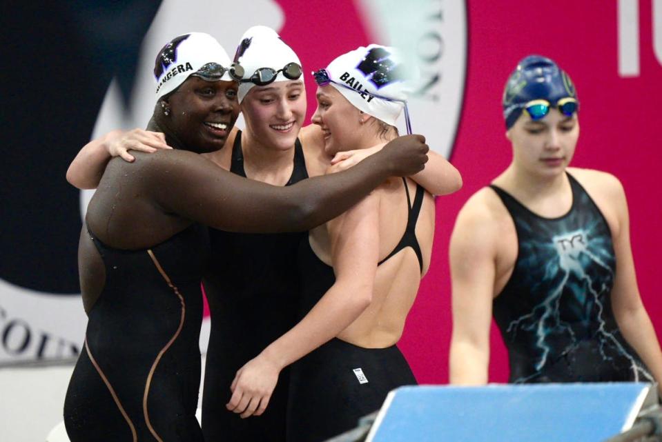 From left: Waukee’s Athieno Wandera, Nora Kemp and Hayden Bailey celebrate after winning the 200 freestyle relay during the IHSGAU state swim meet at the Marshalltown YWCA on Saturday, November 11, 2023 in Marshalltown.