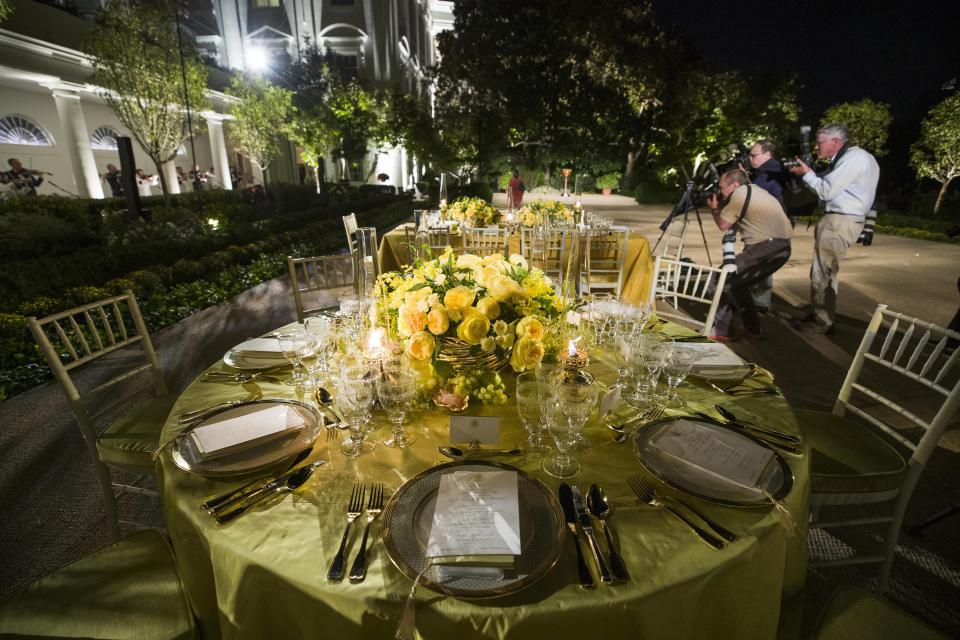 Two tables are set during a media preview for the State Dinner with President Donald Trump and Australian Prime Minister Scott Morrison in the Rose Garden of the White House, Thursday, Sept. 19, 2019, in Washington. (AP Photo/Alex Brandon)