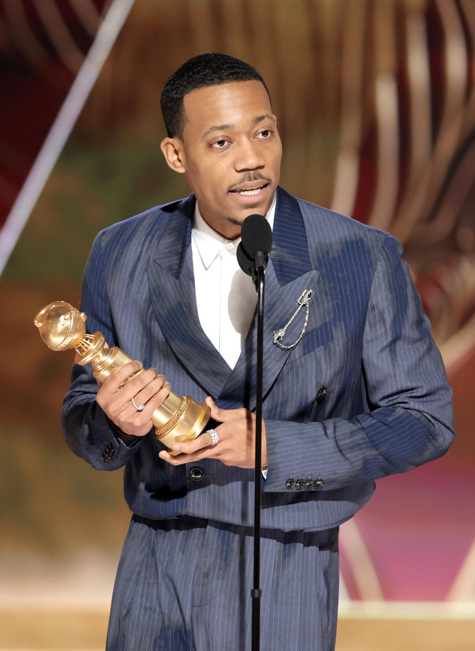 BEVERLY HILLS, CALIFORNIA - JANUARY 10:  In this handout photo provided by NBCUniversal Media, LLC, Tyler James Williams accepts the Best Supporting Actor in a Television Series  Musical-Comedy or Drama award for 