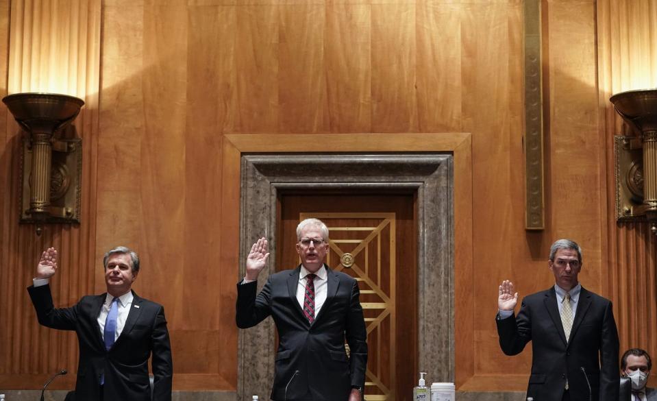 fbi director christopher wray national counterterrorism center director christopher miller and ken cuccinelli, senior official performing the duties of the deputy homeland security secretary, are sworn in before a senate homeland security and governmental affairs committee hearing on 