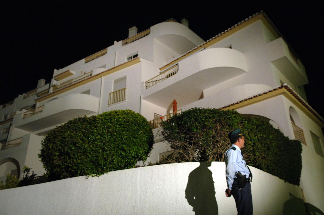 EMBARGOED TO 1915 WEDNESDAY JUNE 3 File photo dated 8/5/2007 of a police officer stands outside the apartment at the Ocean Club Hotel in Luz, Portugal, where Madeleine McCann went missing. A German prisoner has been identified as a suspect in the disappearance of Madeleine, detectives have revealed. The Metropolitan Police have not named the man, 43, who is described as white with short blond hair, possibly fair, and about 6ft tall with a slim build.