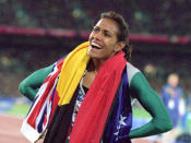 <p>Freeman celebrates with both flags.</p>