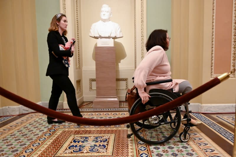 Sen. Duckworth exits the Senate chamber after the third day of the Senate impeachment trial of President Trump