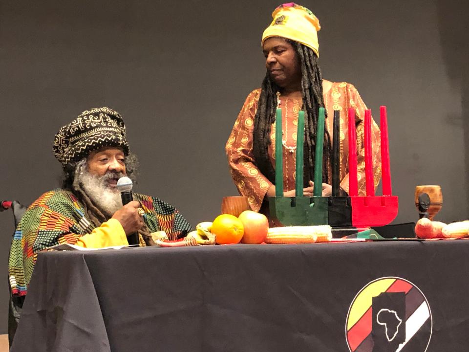 Verge "Brother Sage" Gillam, left, and his wife, Charlotte Pfeiffer, lead the libation ceremony at 2022's Kwanzaa Celebration at the St. Joseph County Public Library in South Bend.