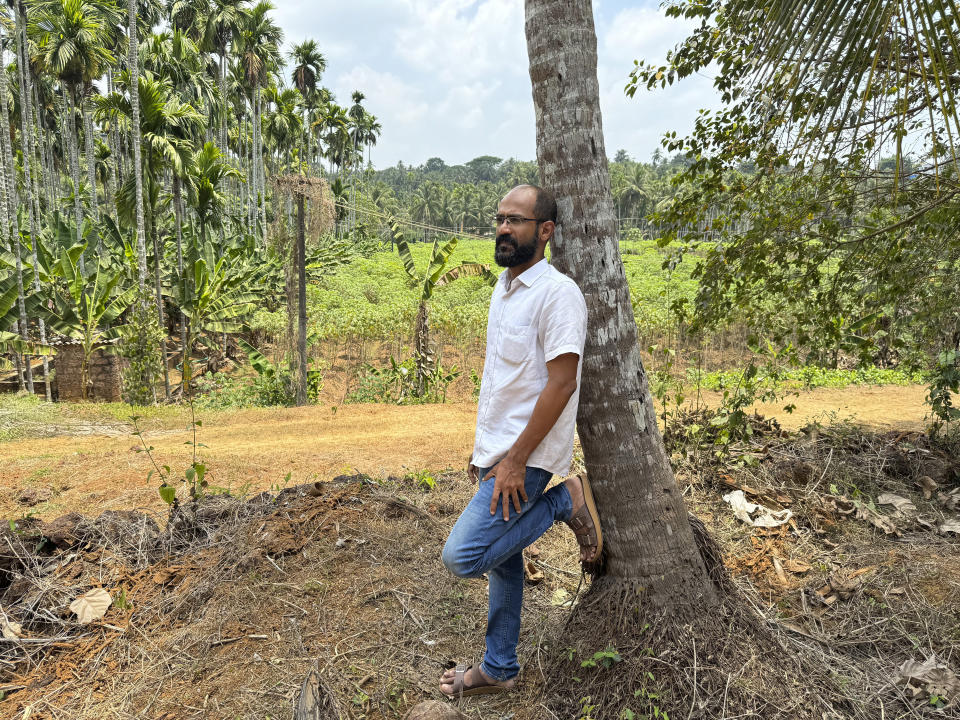 CORRECTS JOURNALIST'S FIRST NAME - Indian journalist Sidhique Kappan poses for a photograph near his home in Kerala, India, April 1, 2024. He was charged in 2020 on allegations of inciting violence while trying to report on a government clampdown in the northern Uttar Pradesh state ruled by the party of Prime Minister Narendra Modi. The time it takes to defend himself has made it difficult to work to support his family. (AP Photo/R S Iyer)