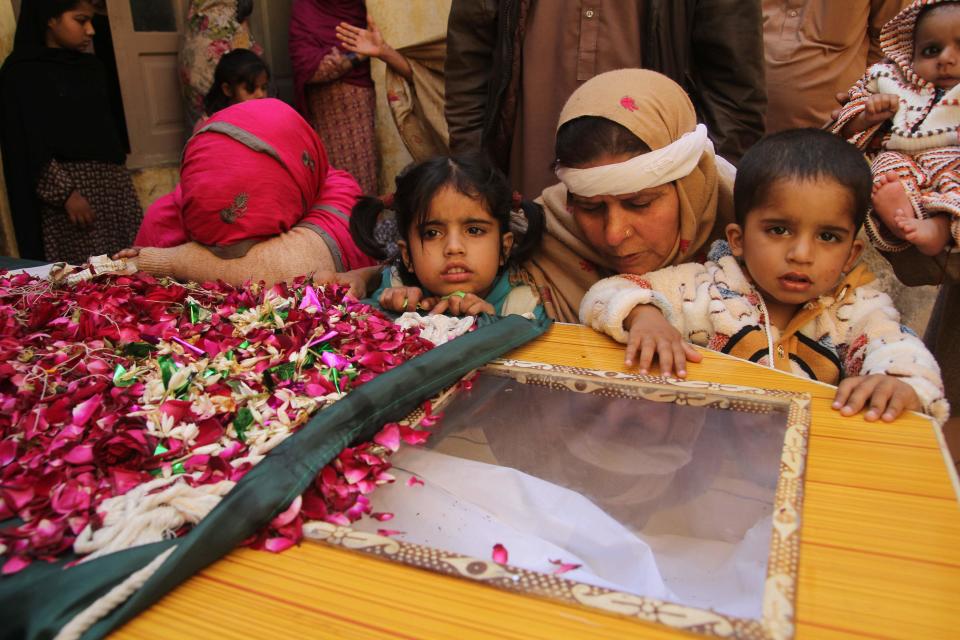 Family members mourn the death of a Pakistani soldier Khuram Ali who reportedly lost his life during heavy shelling from Indian troops at the Line of Control in Pakistani Kashmir, in Dera Ghazi Khan in Pakistan, Monday, March 4, 2019. A key train service with neighboring India resumed and schools in Pakistani Kashmir opened Monday in another sign of easing tensions between the two nuclear-armed rivals since a major escalation last week over the disputed Kashmir region. (AP Photo/Asim Tanveer)