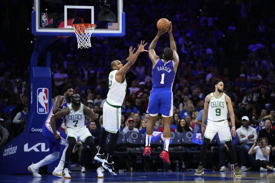 Philadelphia 76ers' James Harden (1) goes up for a shot against Boston Celtics' Al Horford during the second half of Game 4 in an NBA basketball Eastern Conference semifinals playoff series, Sunday, May 7, 2023, in Philadelphia. (AP Photo/Matt Slocum)