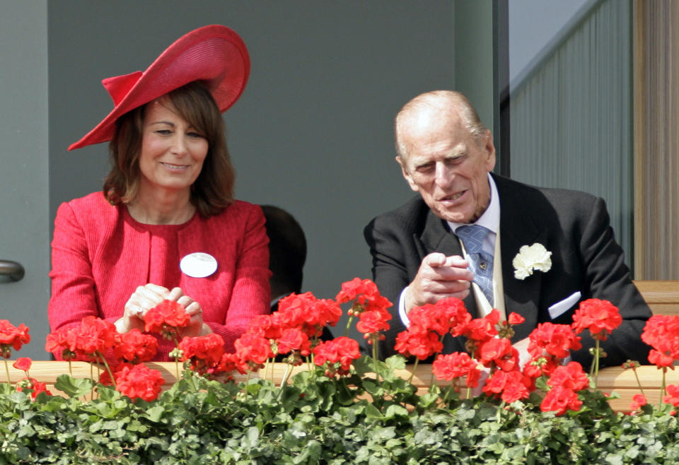 Carole Middleton and Prince Philip, Duke of Edinburgh watch the horses in the parade ring as they attend Ladies Day during Royal Ascot